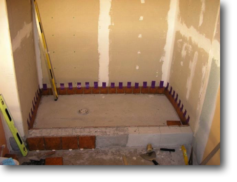 Beginning to tile the bathroom shower.